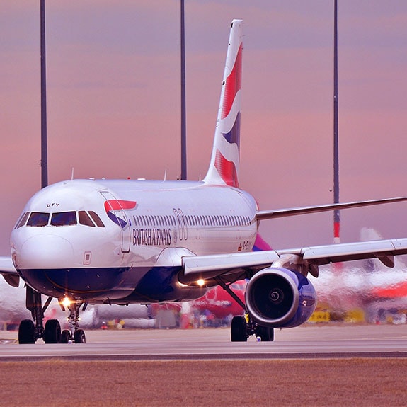 A large airplane parked on the runway.